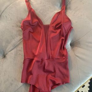 Burgundy silk stretchy bodysuit w mesh cutout.